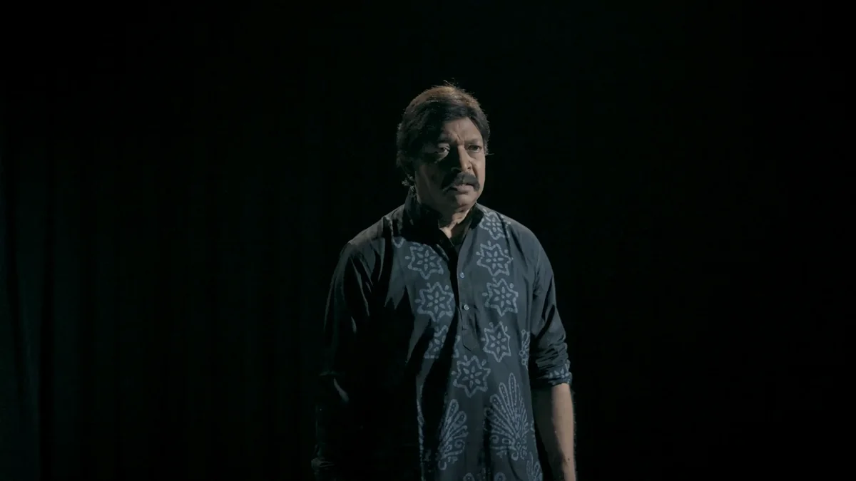 Yash Kirti alone on a dark stage
